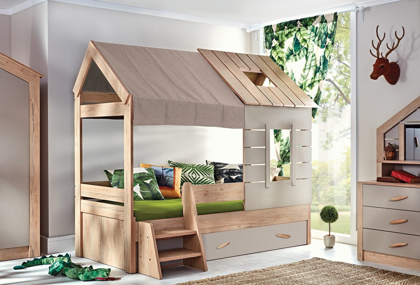My House kids room: wooden house bed, chest of drawers and green cushions